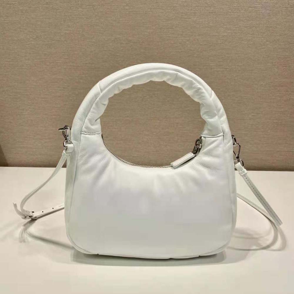 Side view highlighting the soft padded texture of Prada White mini-bag