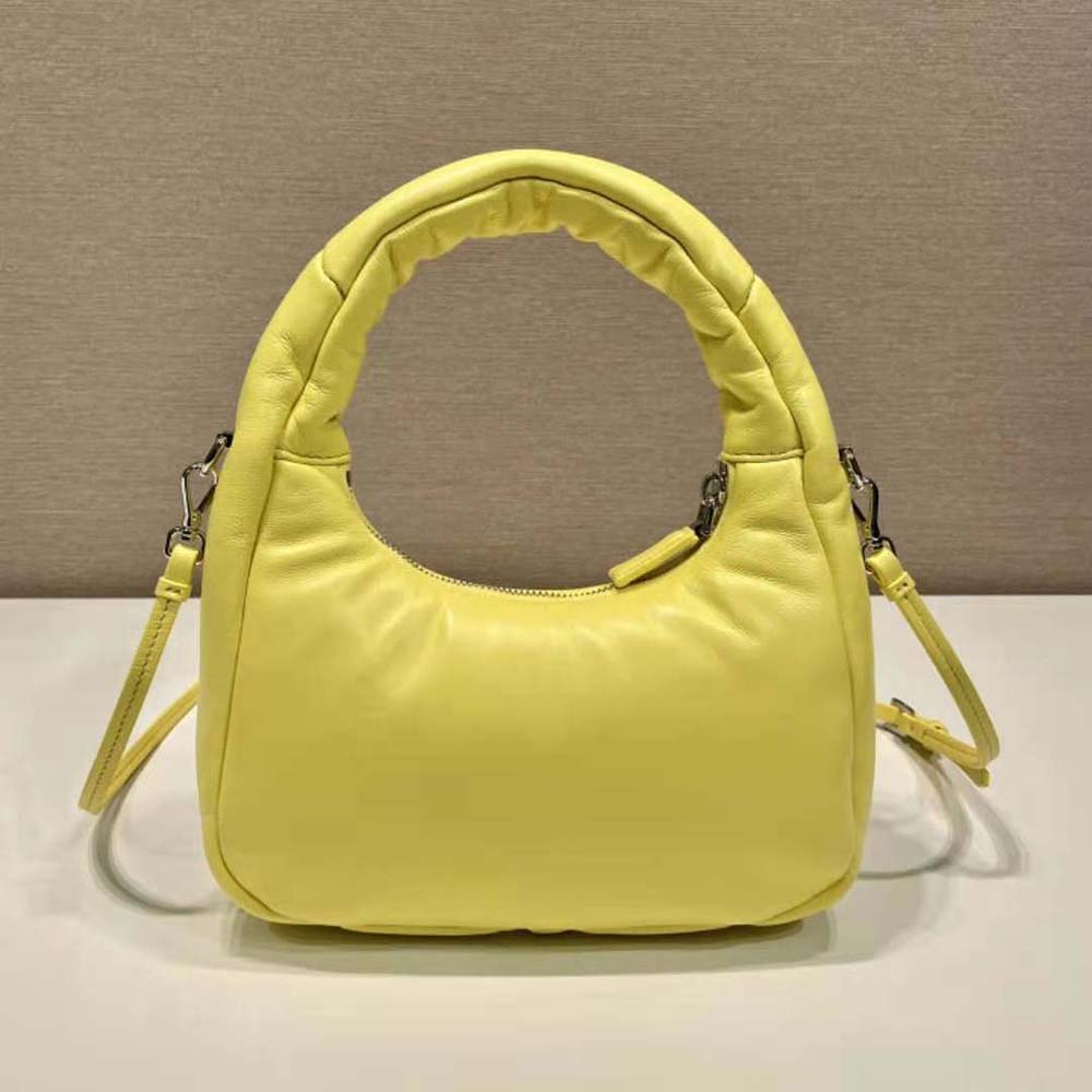 Side angle showing padded texture of Prada Women Soft Padded Nappa Leather Mini-Bag-Yellow