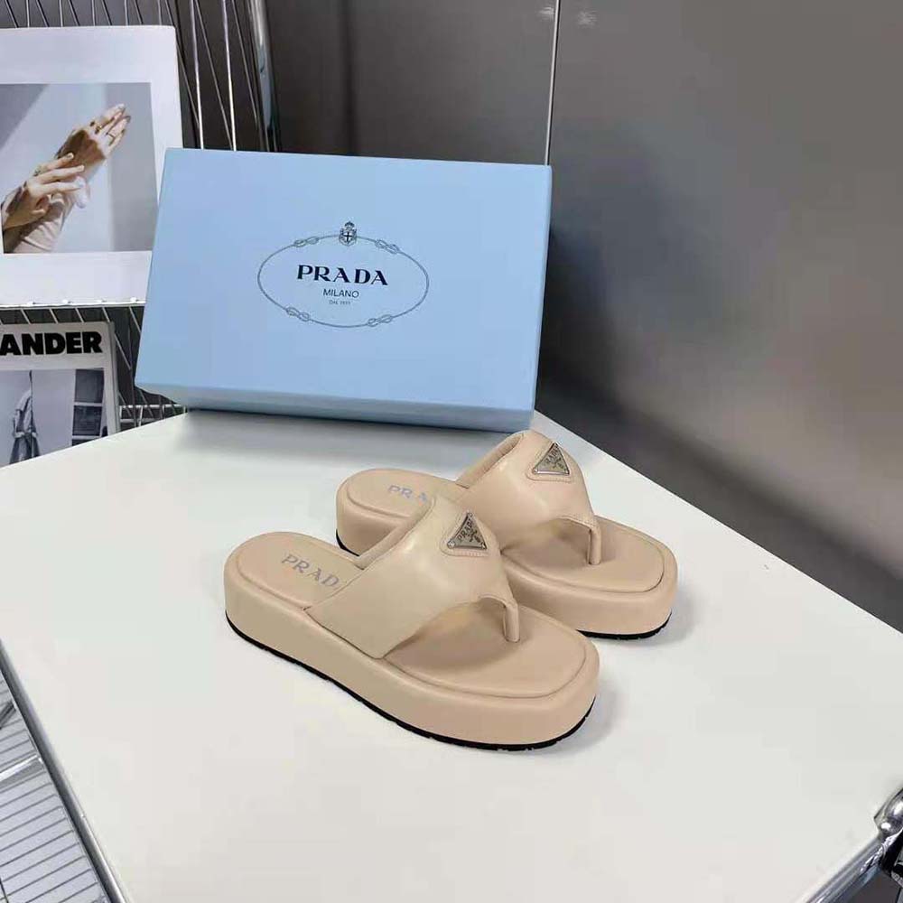 Overhead shot showing padded leather footbed of Prada beige sandals