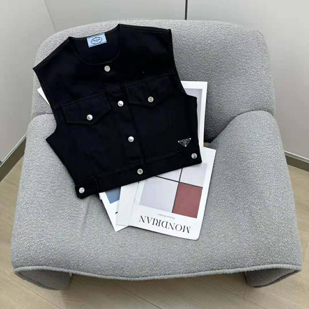 Side angle showing slim fit silhouette of Prada denim vest