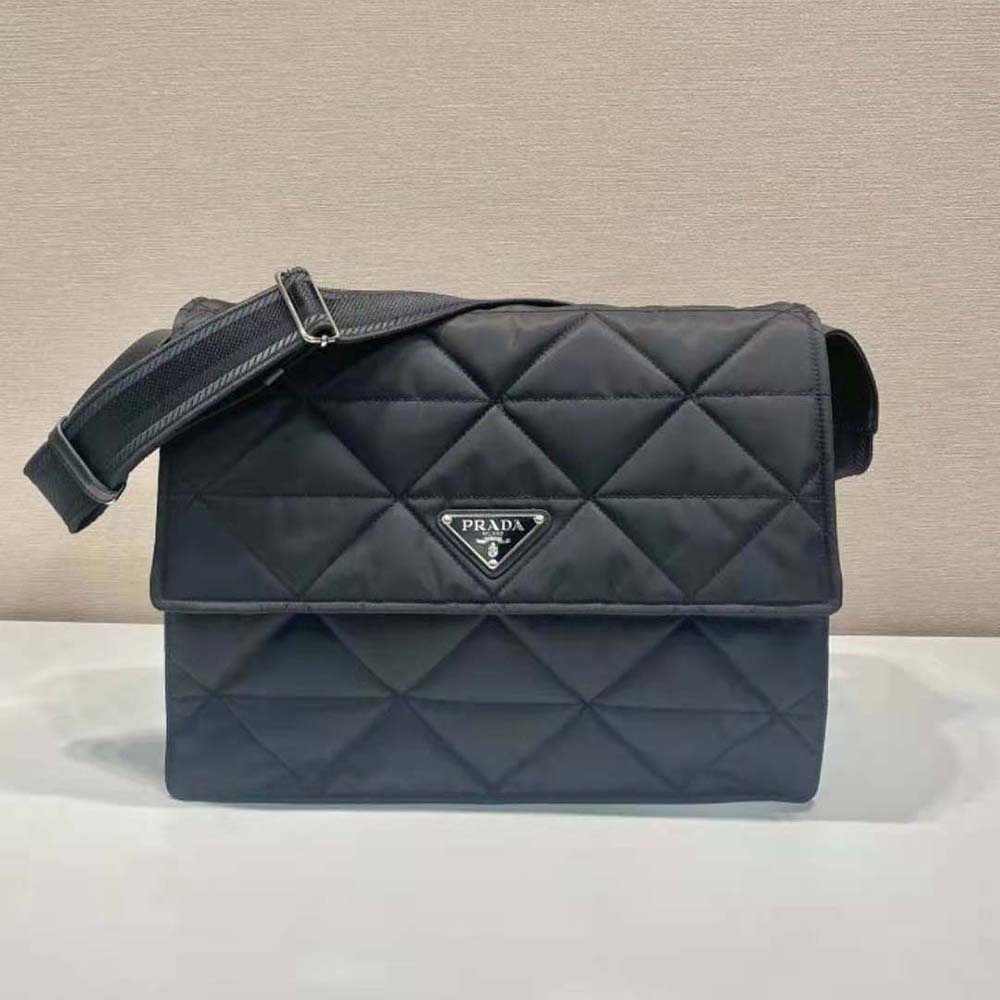 Close-up of topstitch detail and silver hardware on Prada bag