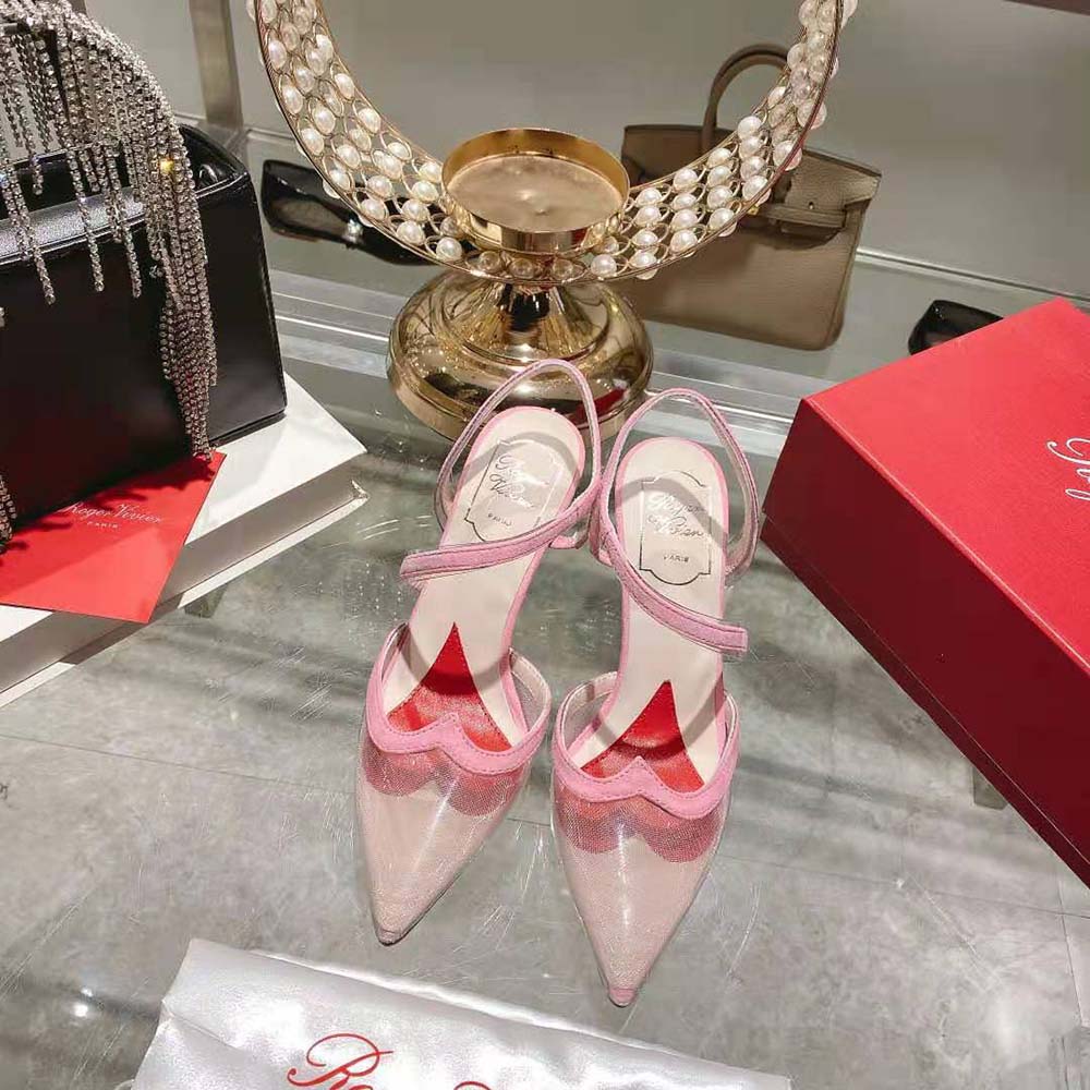 Close-up detail of signature buckle on Roger Vivier Women I Love Vivier Pumps