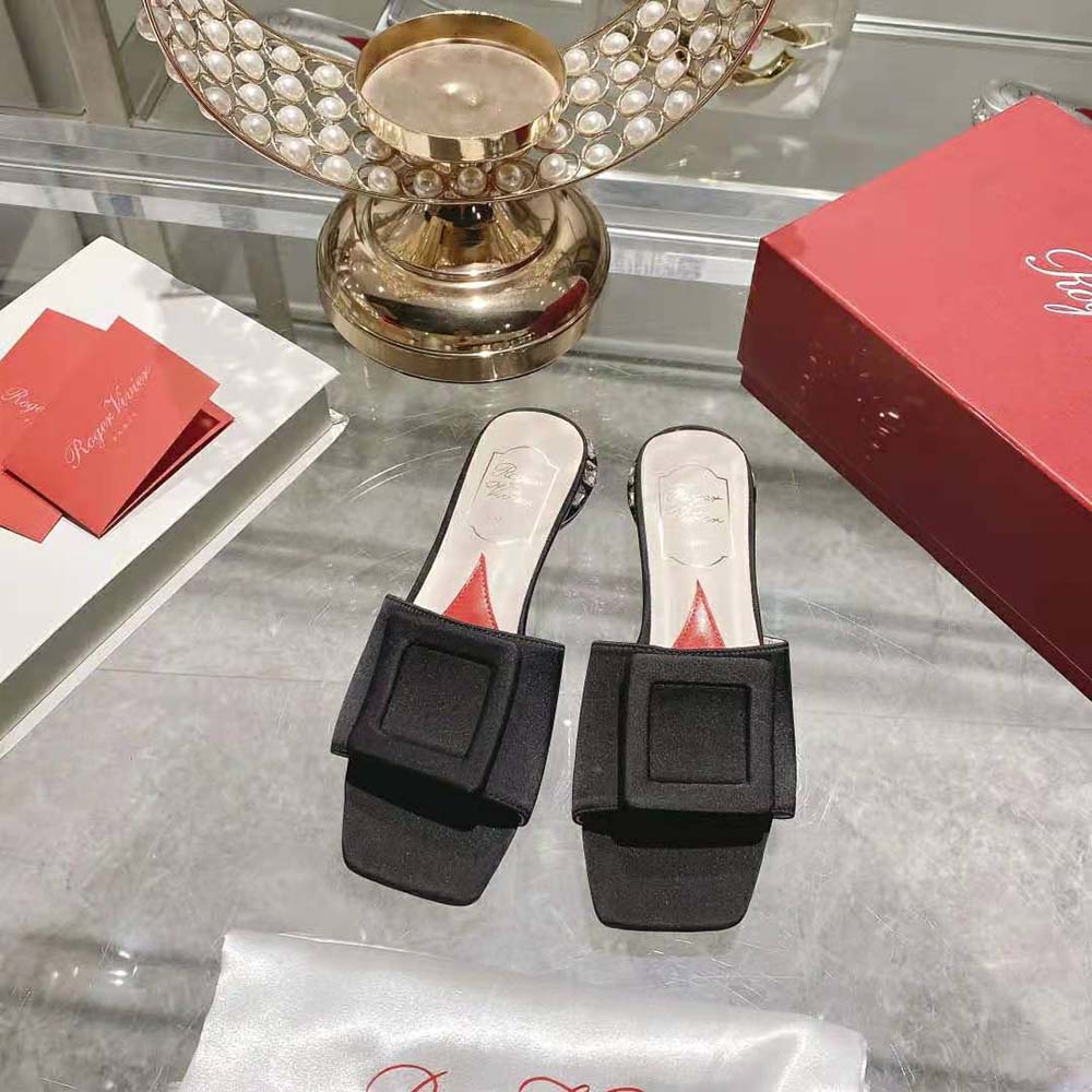 Close-up of strass buckle detail on Roger Vivier satin mules
