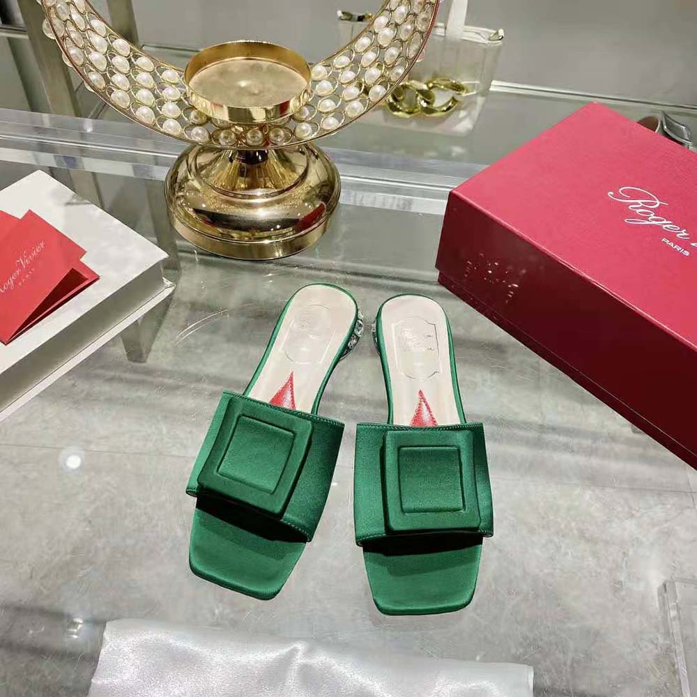 Close-up of strass heel and satin buckle detail on Roger Vivier mules