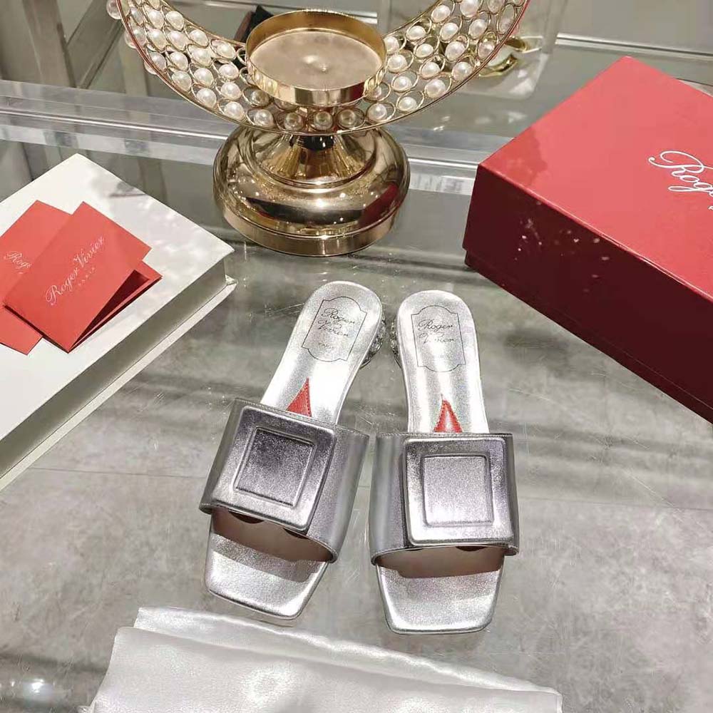 Close-up on silver satin and strass buckle detail, Roger Vivier mules