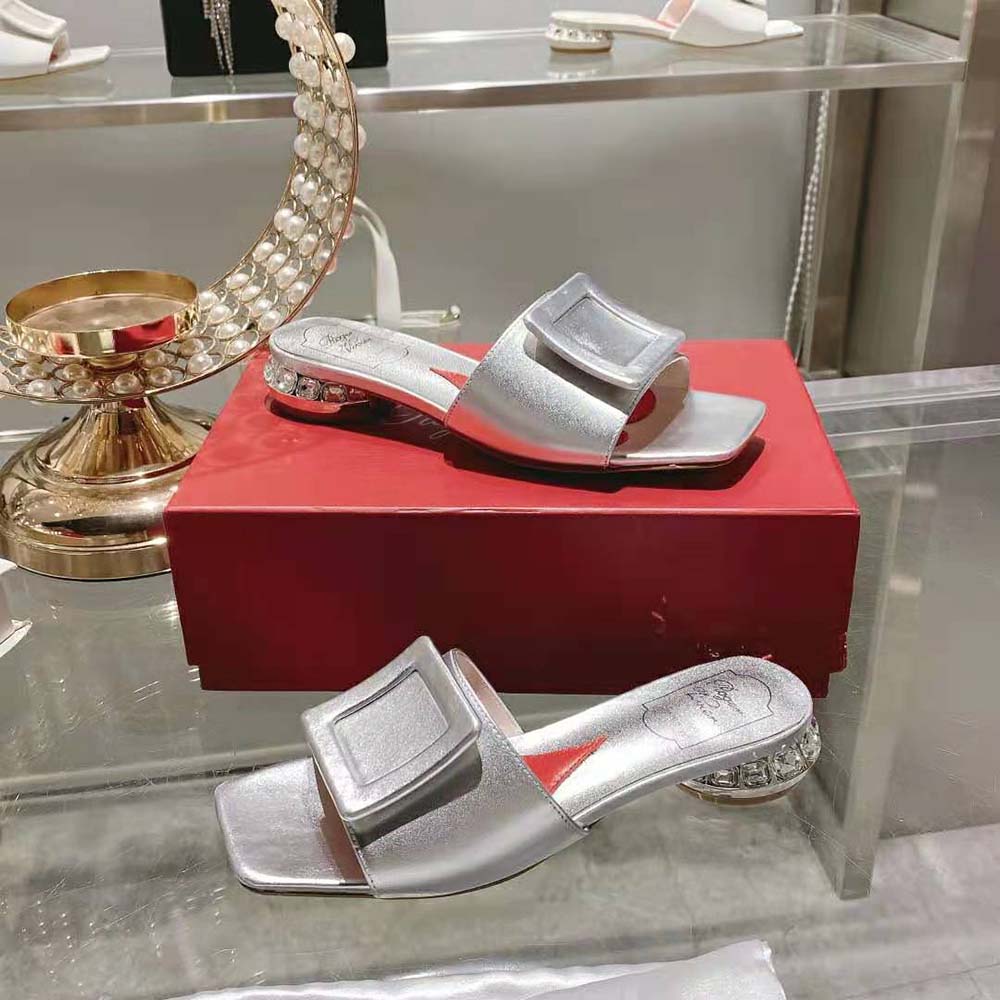 Rear view showing mid-height heel of Roger Vivier satin silver mules