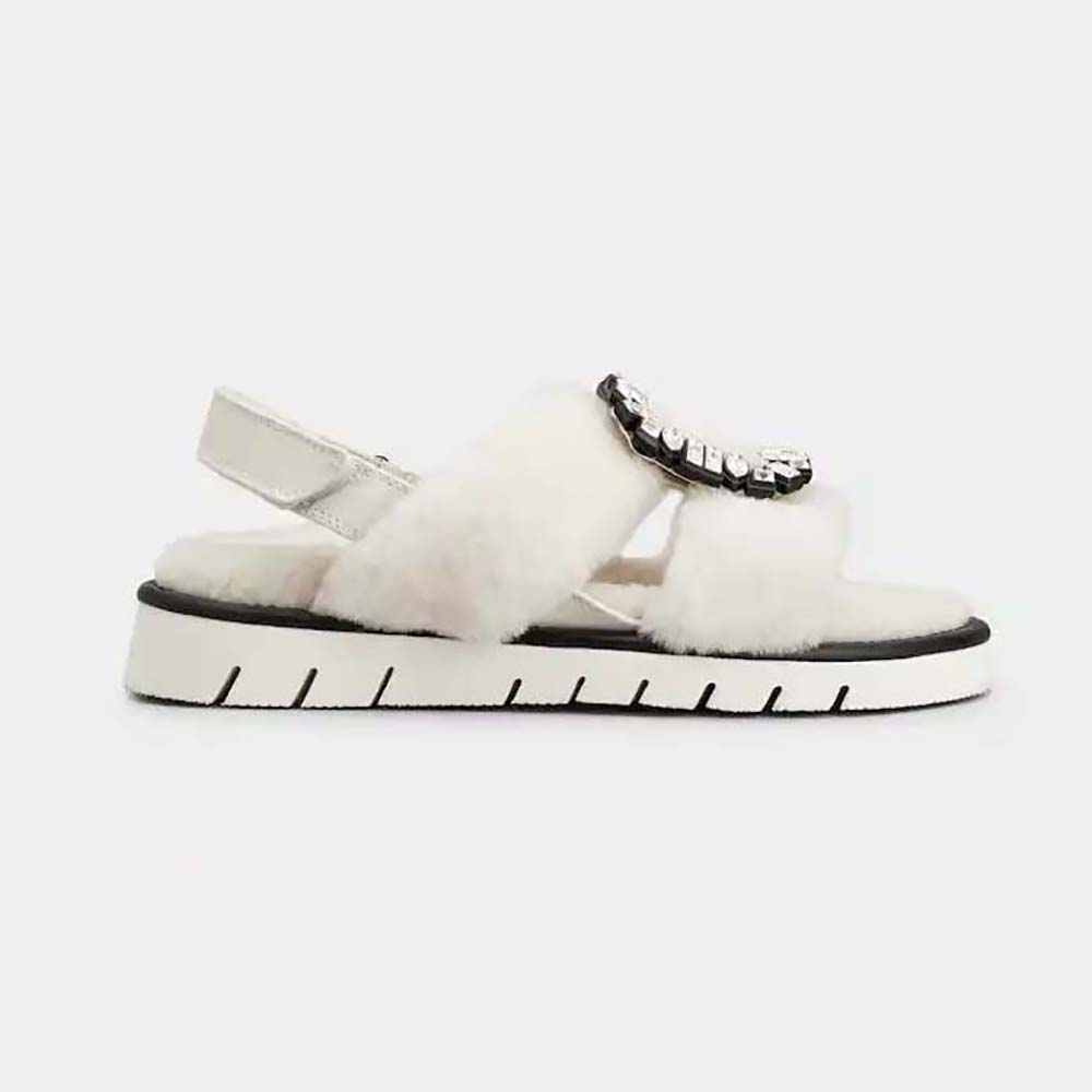 Side view of Roger Vivier Women Viv’ Winter Fur Strass Buckle Sandals in Sheepskin-White