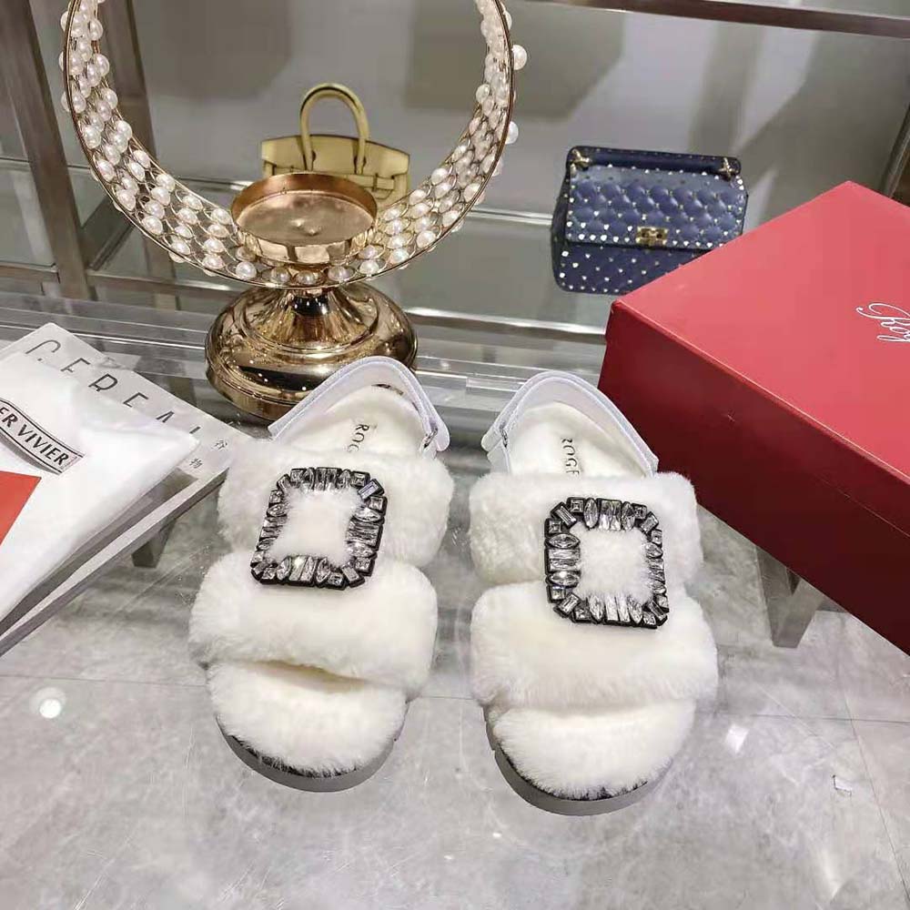 Close-up of sparkling strass buckle on Roger Vivier Winter Fur Sandals