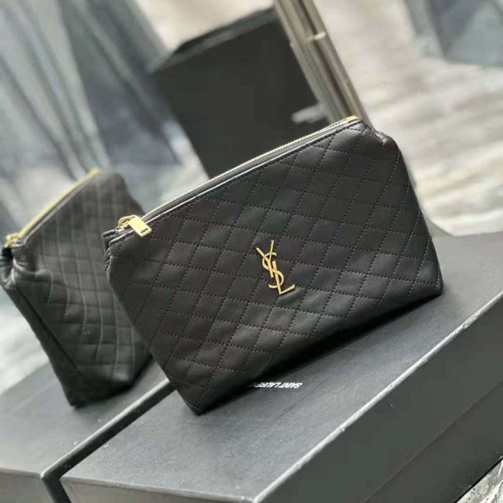 Side angle showing zip closure and supple leather texture of cosmetic pouch