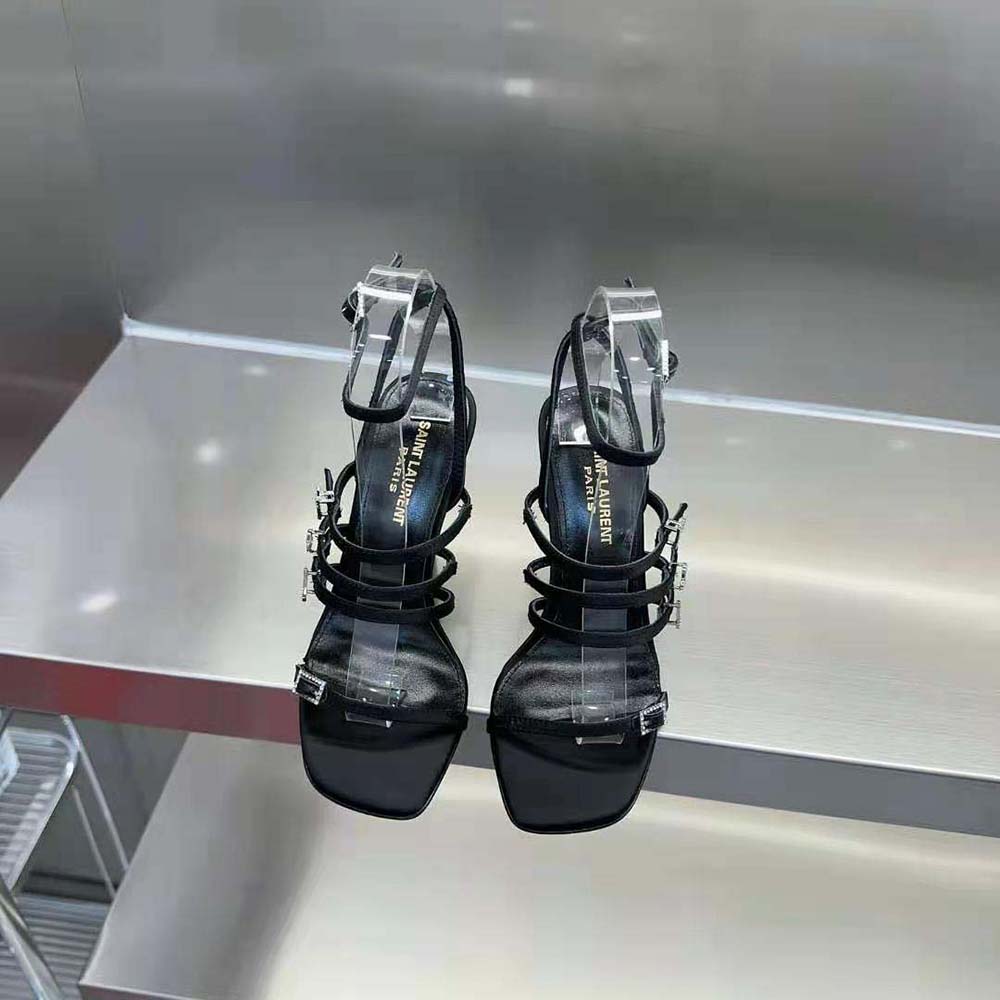 Close-up of YSL rhinestone logo detail on Jerry Sandals strap