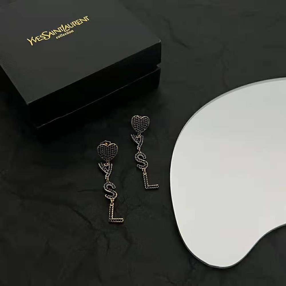 Close-up of crystal and heart motif on Saint Laurent YSL Women Opyum Earrings