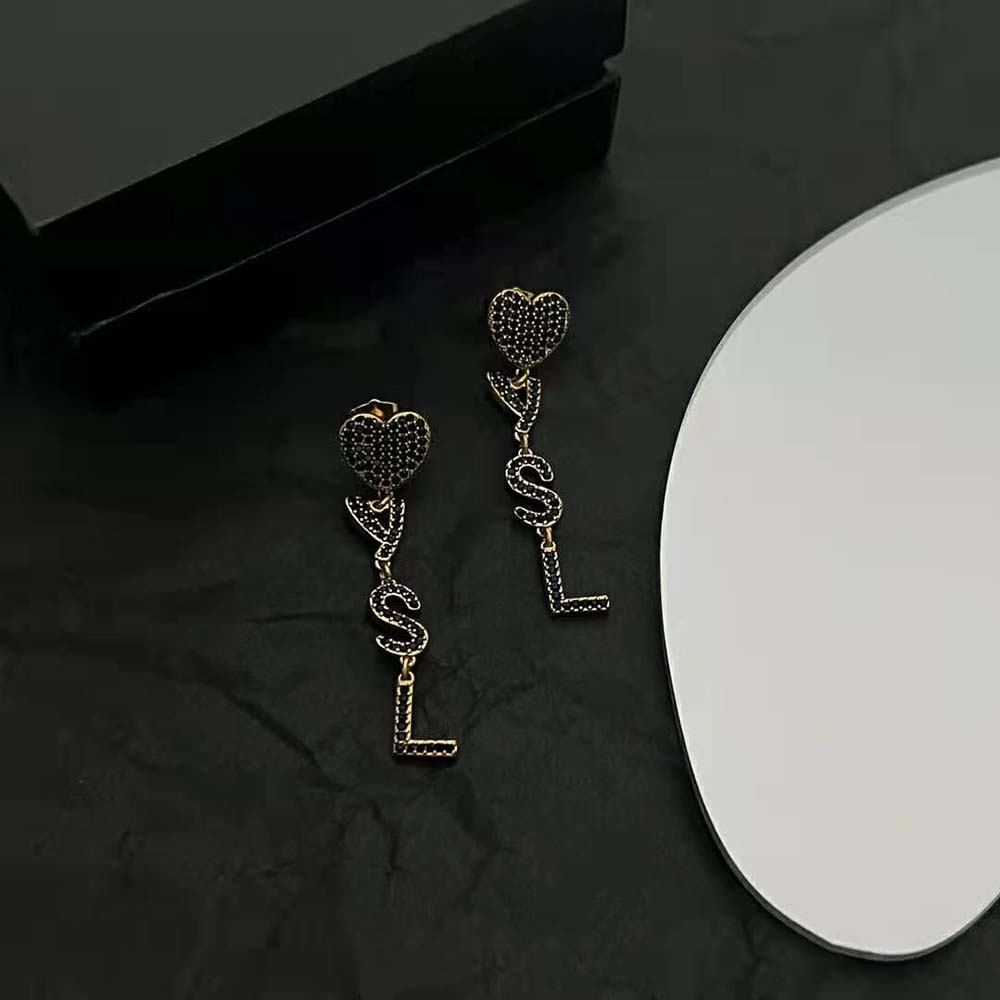 Side angle showing post closure of Saint Laurent YSL Women Opyum Heart Earrings