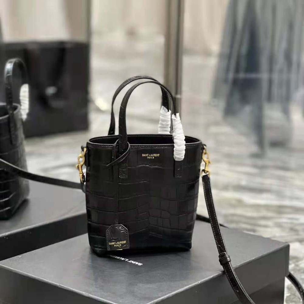 Side angle showing compact silhouette and magnetic closure of Saint Laurent YSL mini bag