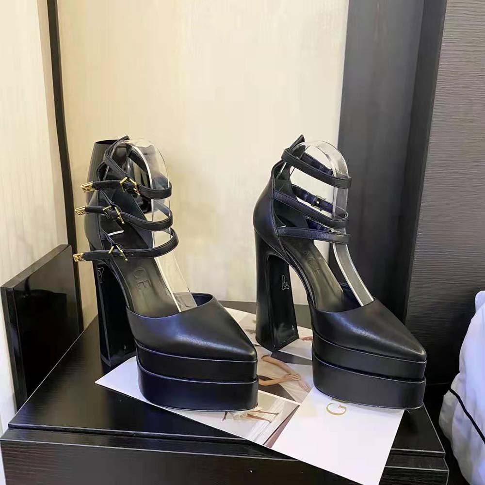Close-up of gold Medusa emblem on Versace Women Aevitas Pointy Platform Pumps