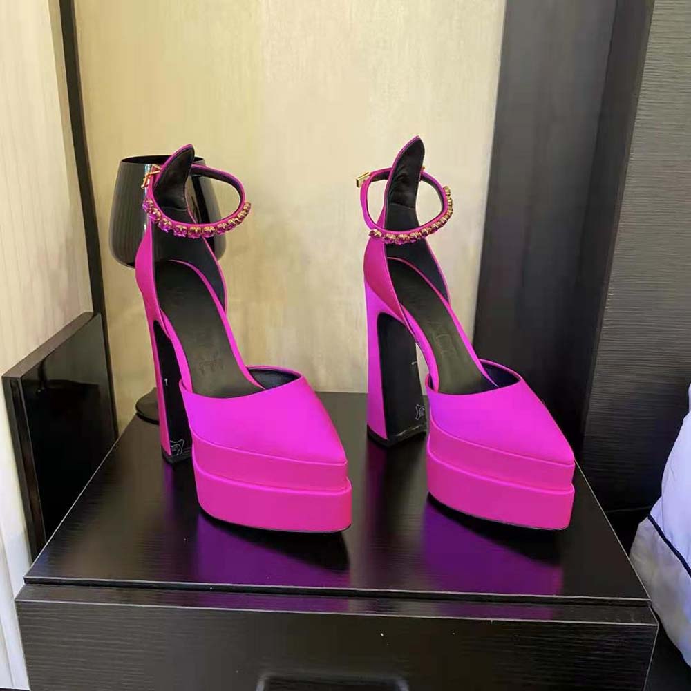 Close-up of gold Medusa detail on Versace Aevitas Pink Pumps