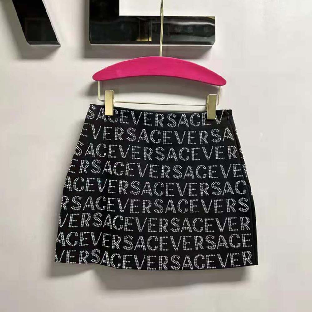 Side angle showing tailored fit of Versace Women Crystal Versace Allover Mini Skirt