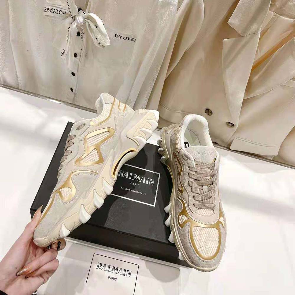 Top angle showing tonal laces and low-top silhouette of Balmain B-East Trainer