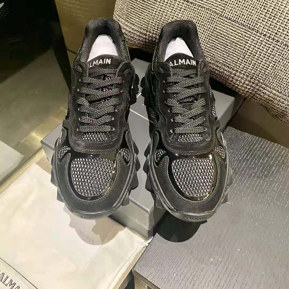 Close-up on Balmain logo and lace closure of B-East Trainer black