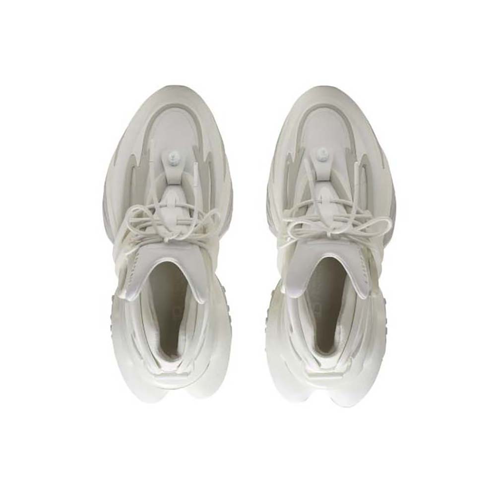 Rear view showing embossed Balmain logo on white Unicorn Trainers