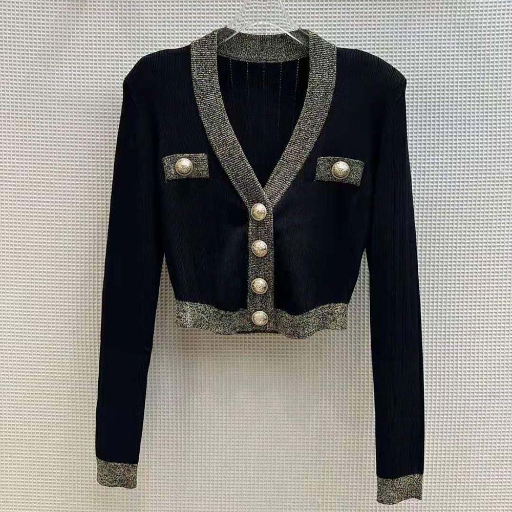 Close-up of gold button detail on Balmain Women Cropped Knit Cardigan