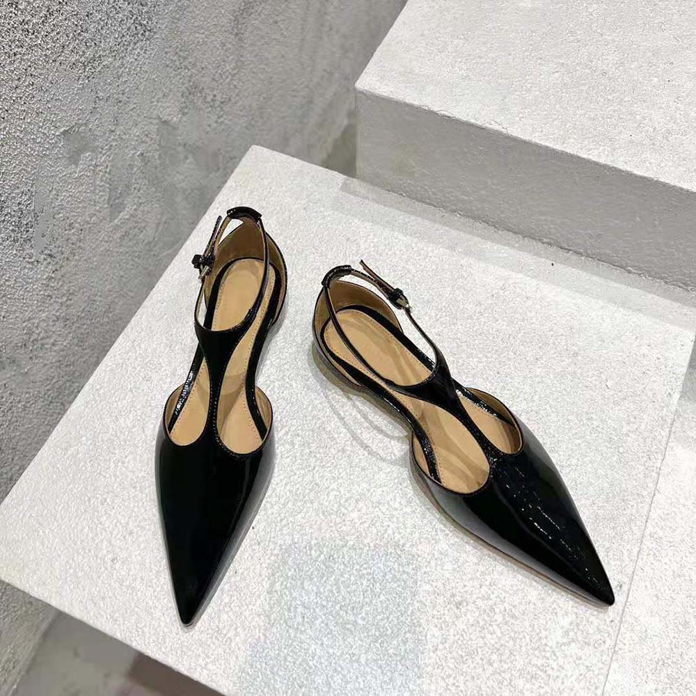 Close-up on T-bar strap and laminated leather texture of the ballerina flat