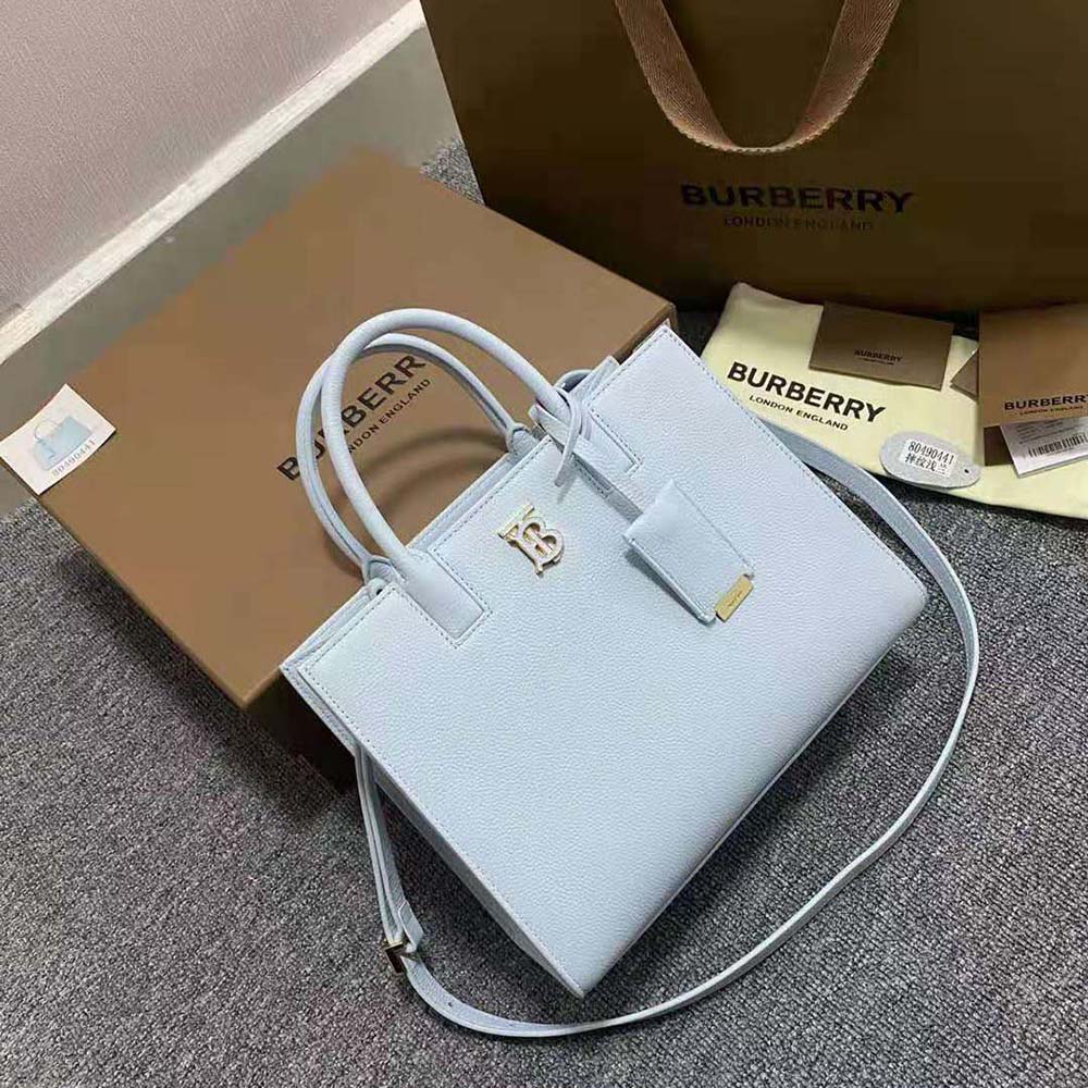 Close-up of gold-tone Thomas Burberry Monogram hardware on Mini Frances Bag