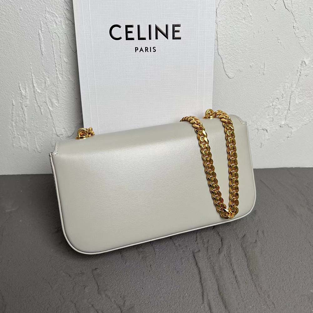 Close-up of gold-tone Triomphe chain and clasp on Celine shoulder bag