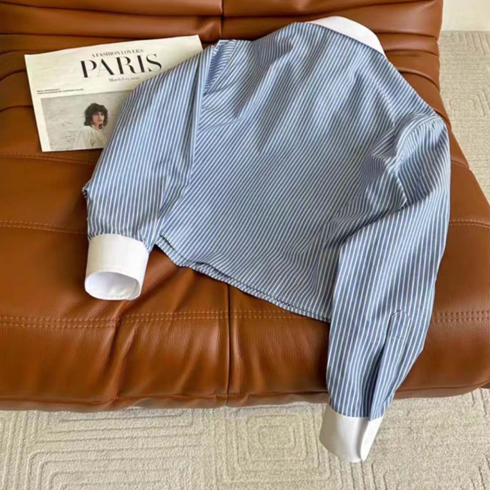 Side angle of Celine Women Cropped Shirt in Striped Cotton highlighting silhouette