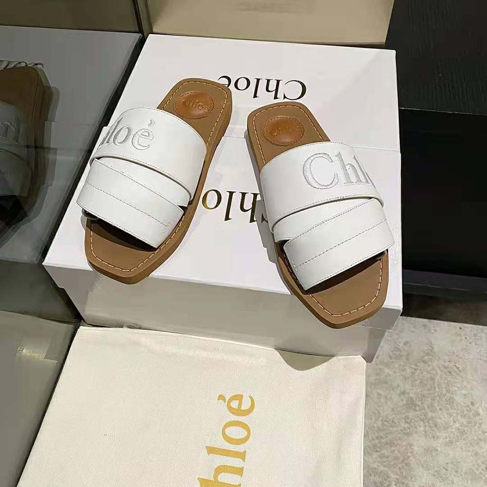 Top detail of wooden sole and Chloé embossed branding on mule