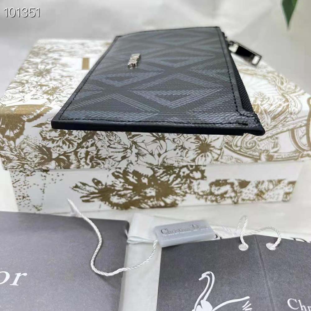 Side profile showing slim silhouette of Dior Men Zipped Card Holder