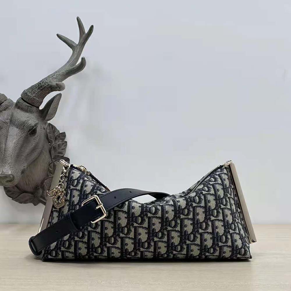 Close-up of silver-tone clasp on Dior Women Club Bag