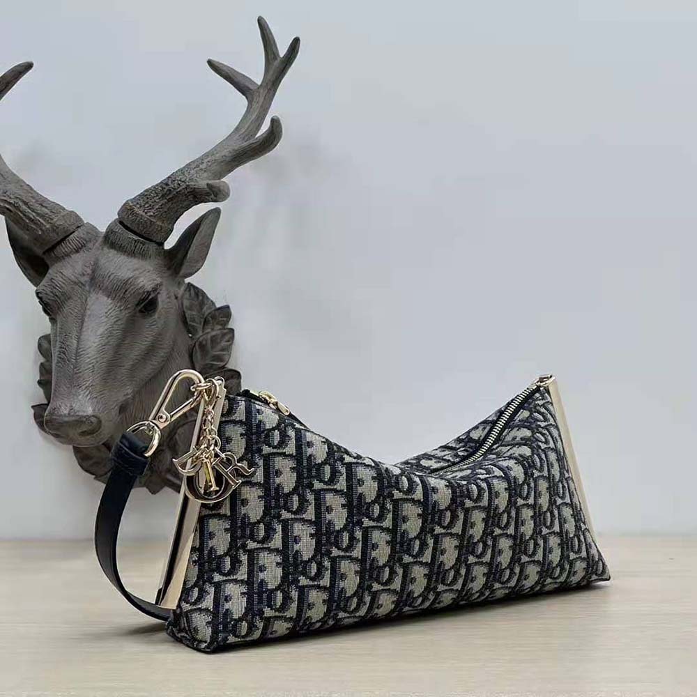 Side profile showing adjustable strap on Dior Women Club Bag