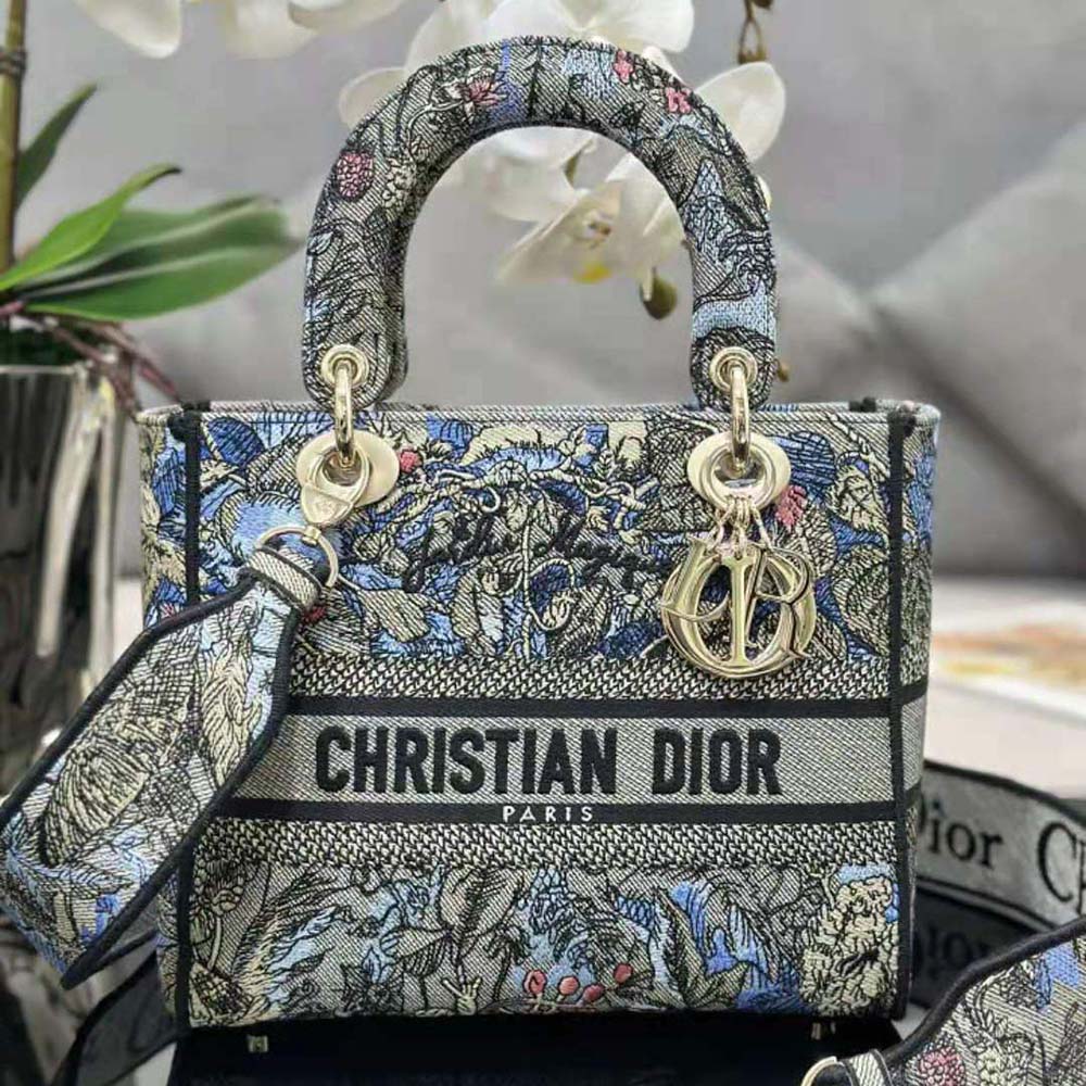 Close-up on multicolor Dior Jardin Magique embroidery on denim Lady D-lite bag