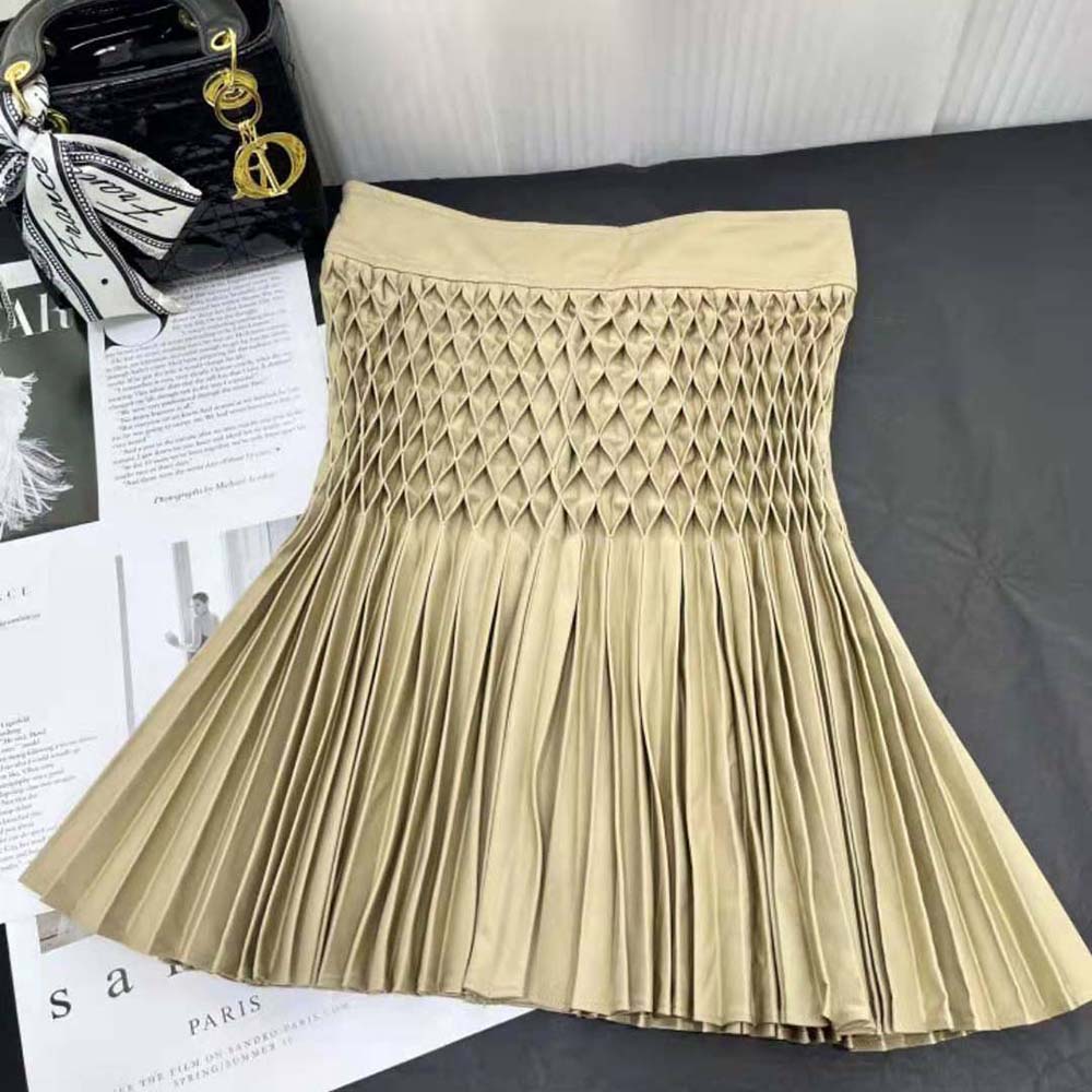 Side profile showcasing silhouette of Dior Women Pleated Short Skirt Beige