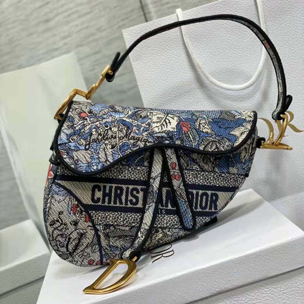 Close-up on multicolor garden embroidery on Dior Women Saddle Bag Denim