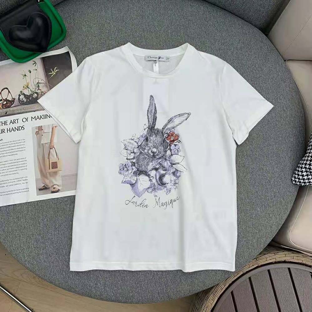 Close-up of Dior Jardin Magique motif embroidery detail on white T-shirt