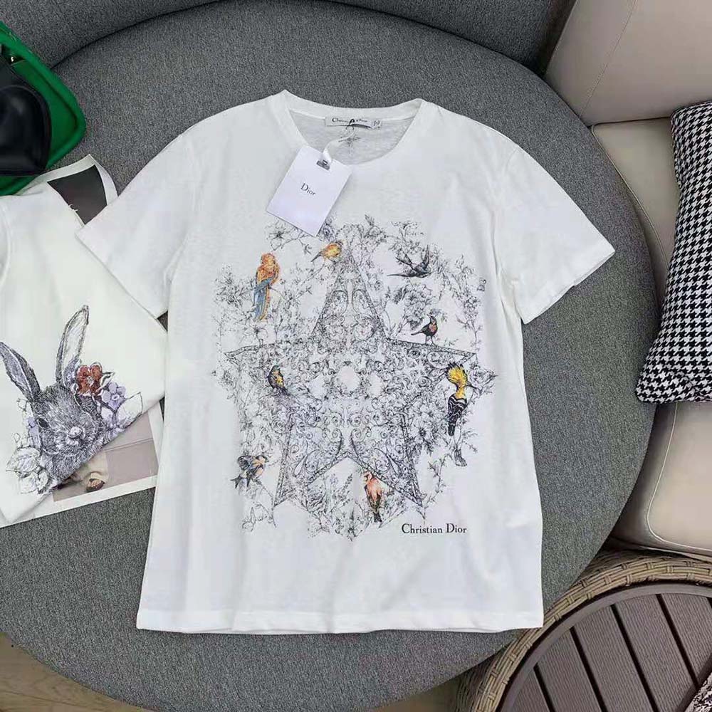 Close-up of Dior Sevilla Star motif embroidery on white t-shirt