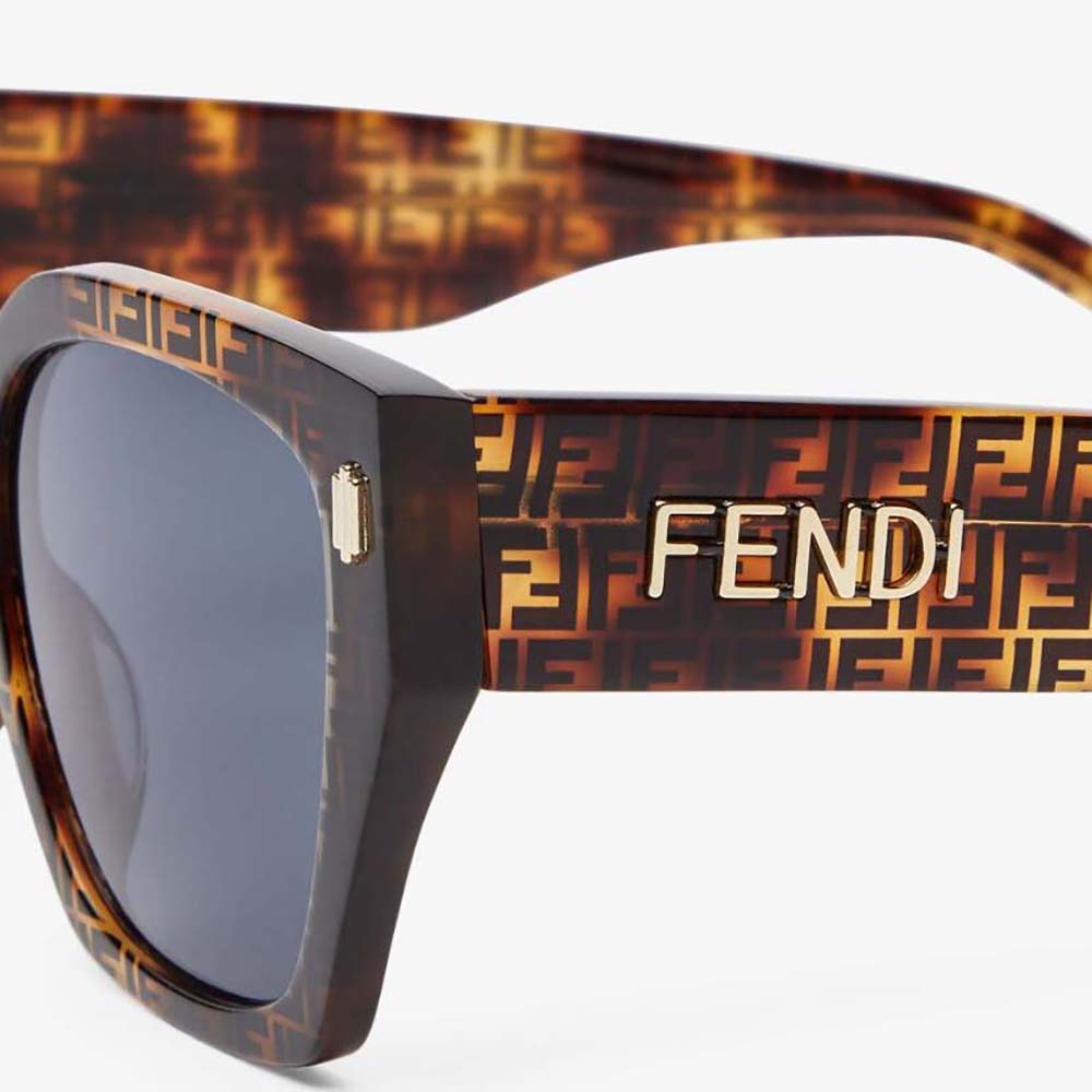 Side angle highlighting low bridge design on Fendi Unisex Havana sunglasses