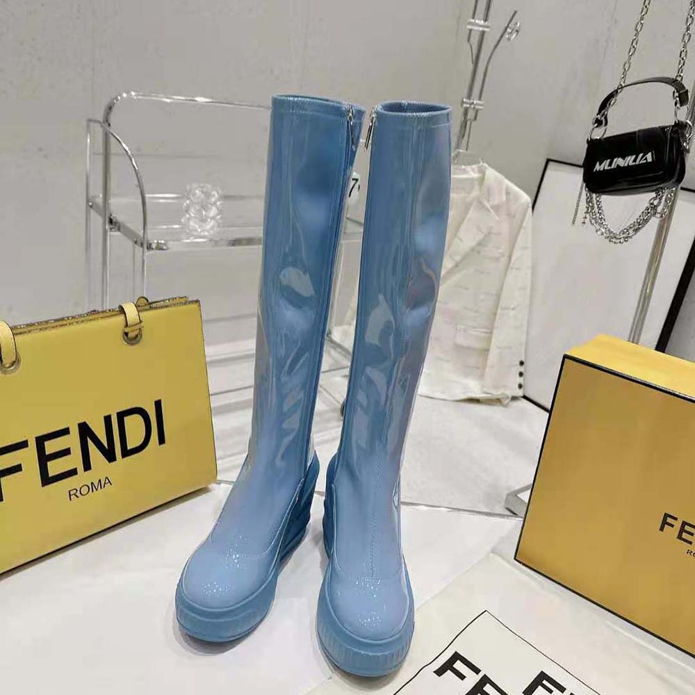 Close-up on gold-tone hardware detail of Fendi Blue Patent Leather Boots