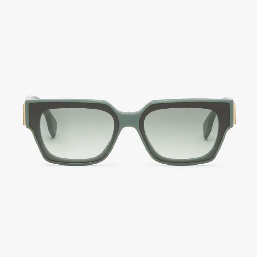 Close-up of dark green acetate frame and gold Fendi logo detail on sunglasses