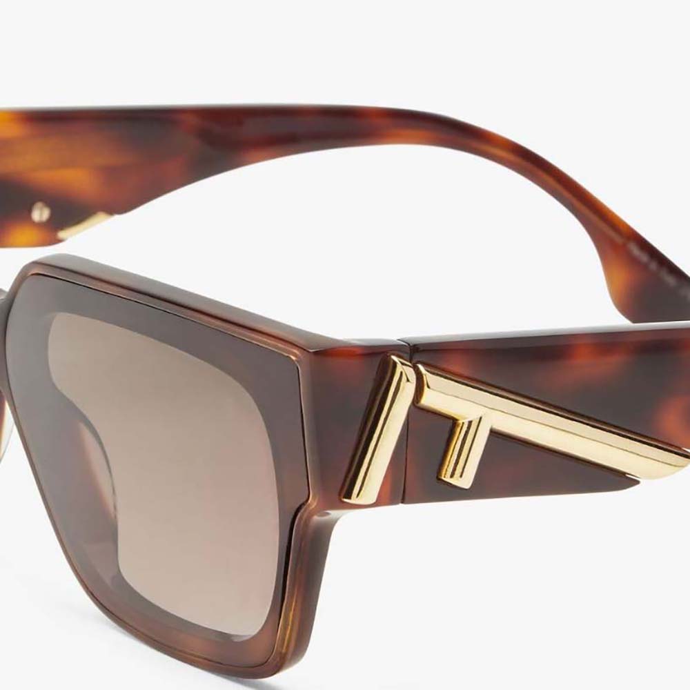 Side angle showing smooth Havana acetate frame of Fendi First sunglasses