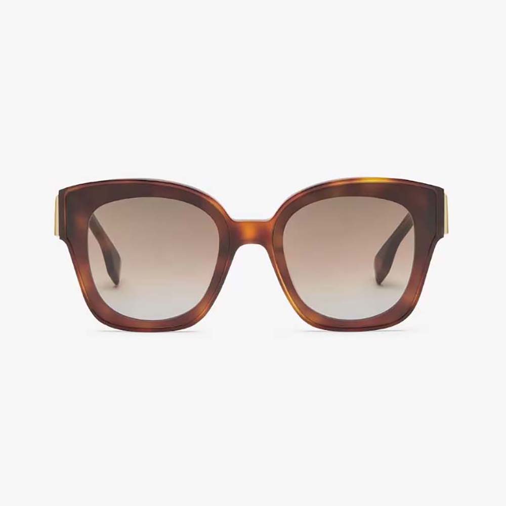 Close-up of gold Fendi logo detail on Havana acetate sunglasses