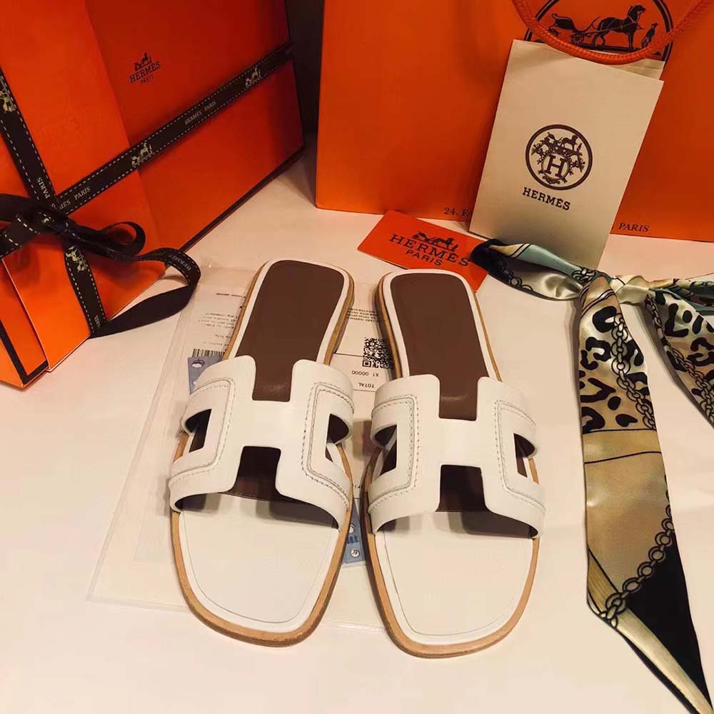 Close-up of iconic white ‘H’ cut-out on Hermes Women Oran Sandal