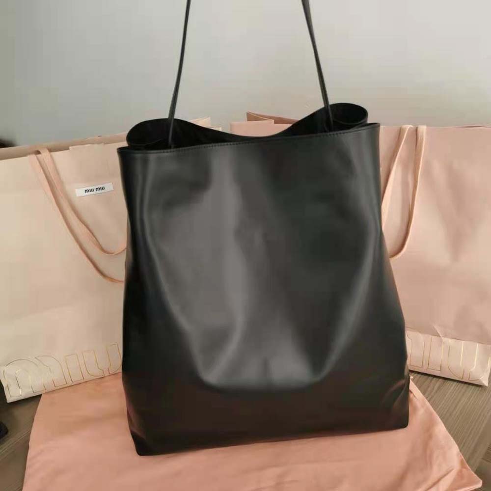 Side angle showing structured silhouette of Miu Miu Women Leather Shoulder Bag