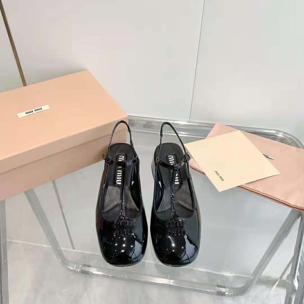 Close-up of patent leather and metal buckle on Miu Miu slingbacks