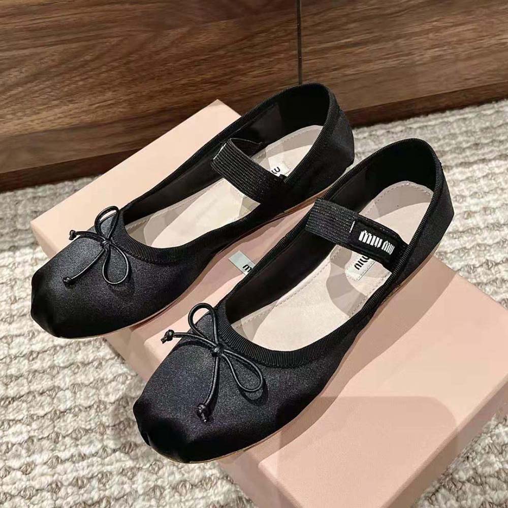 Side profile showcasing satin finish and silhouette of Miu Miu ballerinas