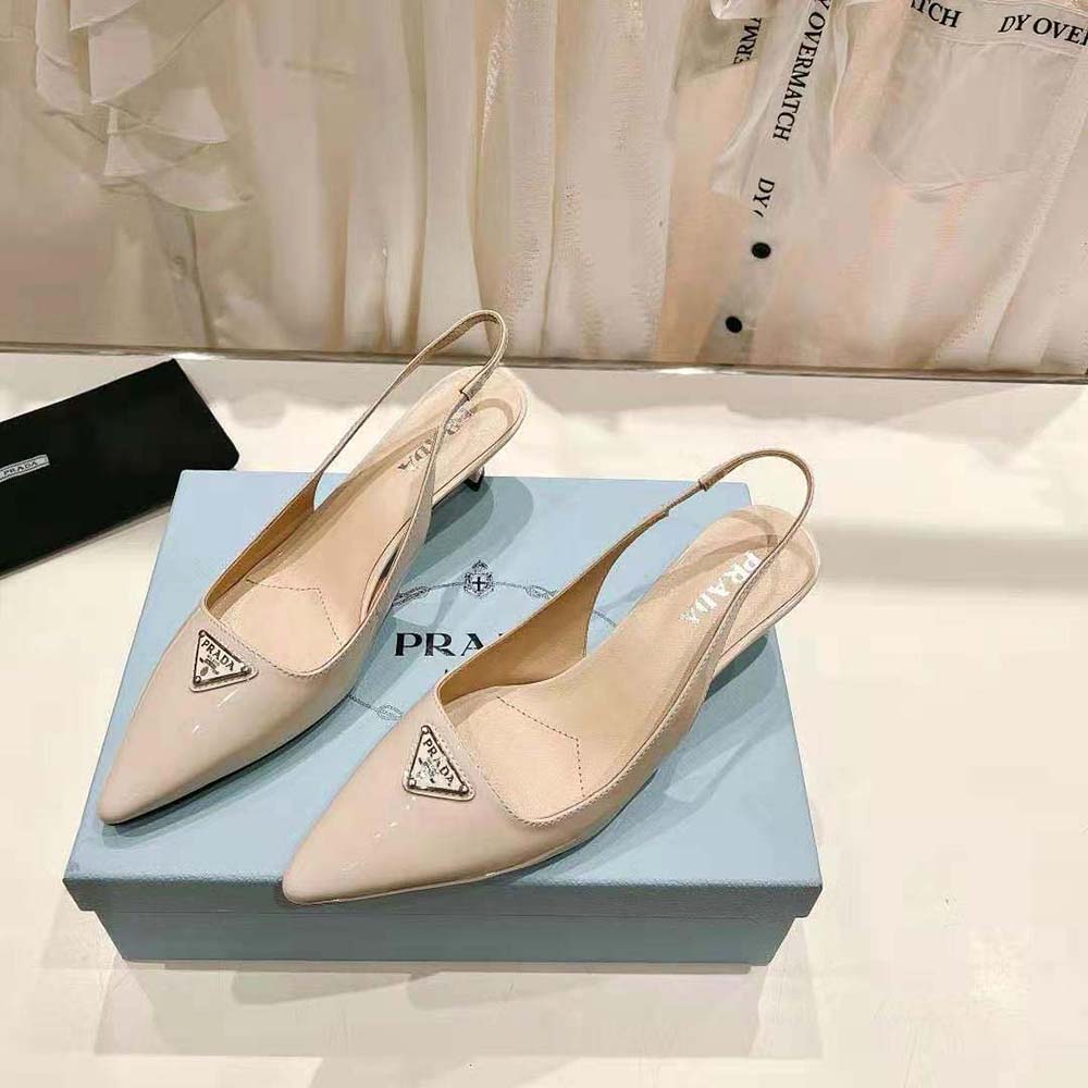 Rear angle highlighting adjustable slingback strap on Prada White Patent-Leather Pumps