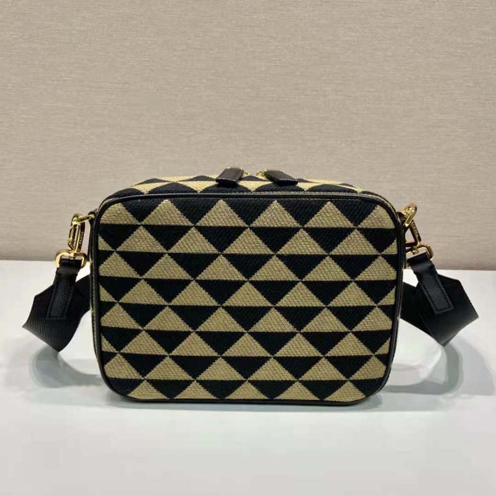 Side angle showing compact silhouette of Prada Women Symbole Embroidered Fabric Bag