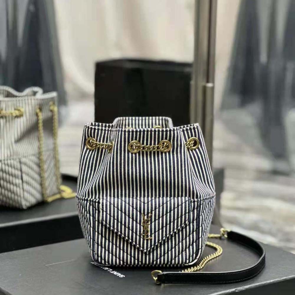 Close-up of gold YSL logo hardware on Joe Mini Bucket Bag