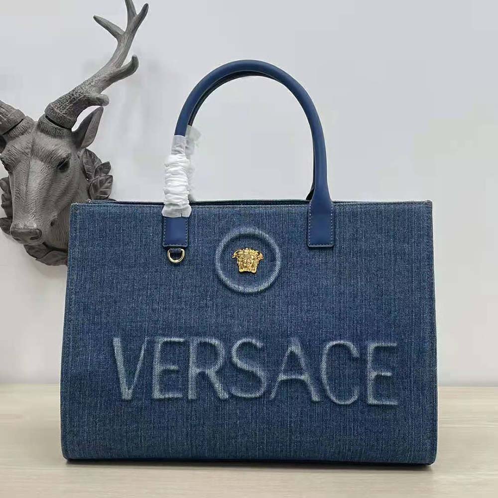 Close-up of gold Medusa clasp detail on Versace Women La Medusa Large Tote Bag-Navy